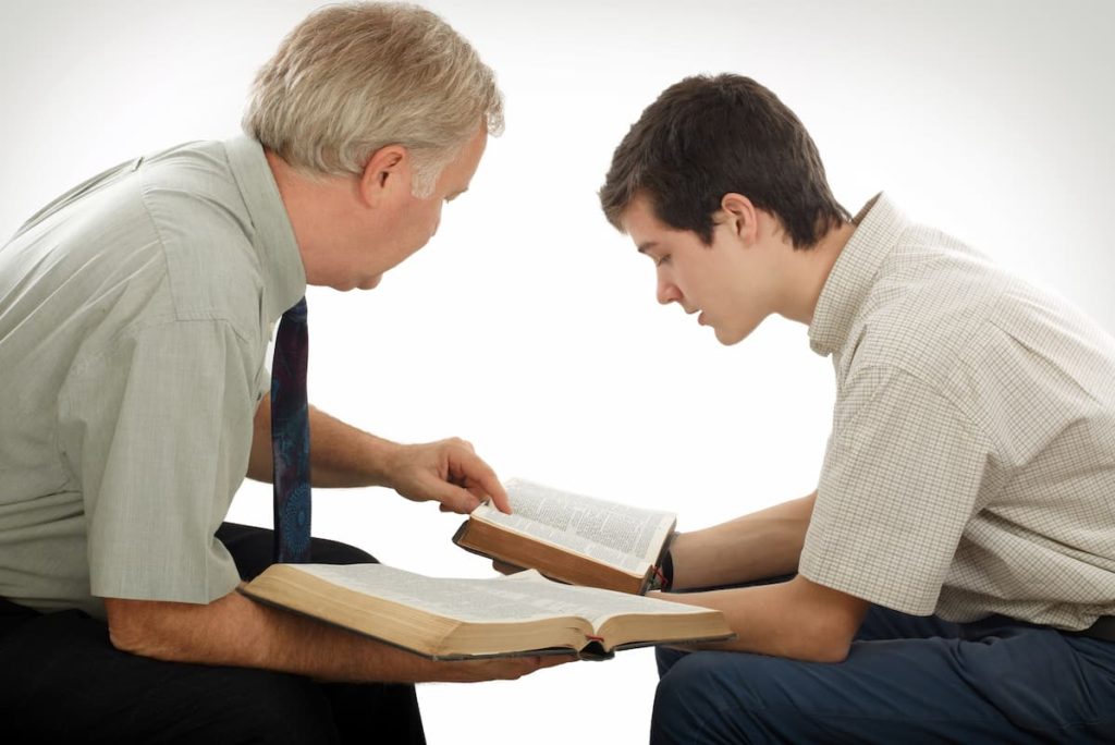 Man studying with a spiritual father and mentor