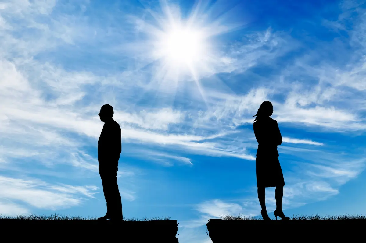 Silhouette of man and woman with blue sky in background for blog post on how to Get Over the Father of Your Child