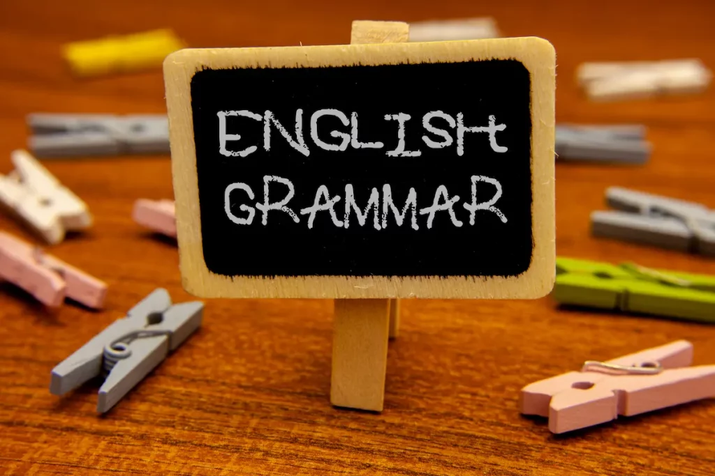 mini chalk board sign with writing stating "English Grammar"