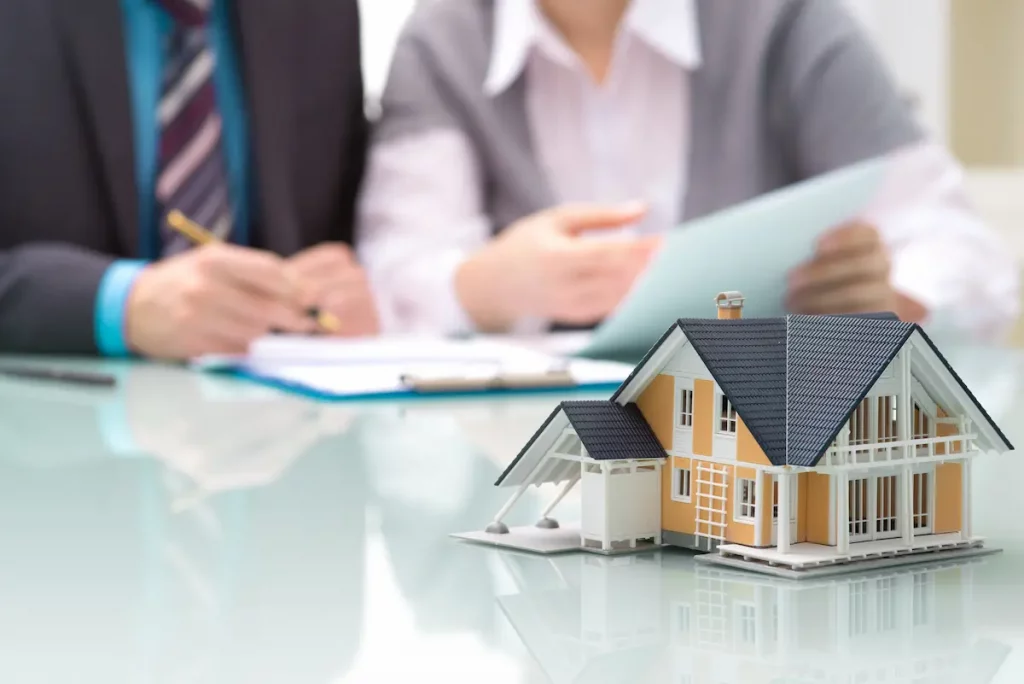 Man and women doing paper work to sell their father's property