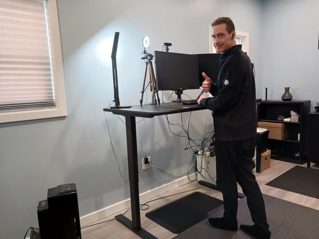 Stuart Cameron MSW, RSW demonstrating using a standing desk to improve his sleep at night.