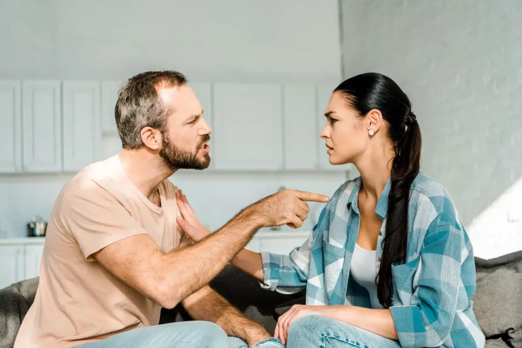 Husband who constantly questions his wife on bed while wife tries to calm him down