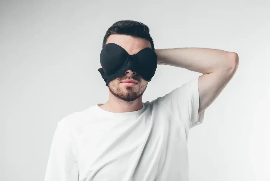 Husband Want To Wear Wife's Bra And Panties and is holding a bra over his face like sunglasses