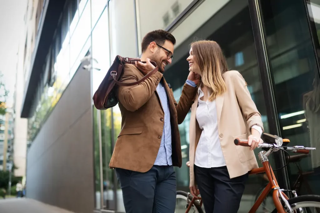 Man flirting with a coworker outside the office