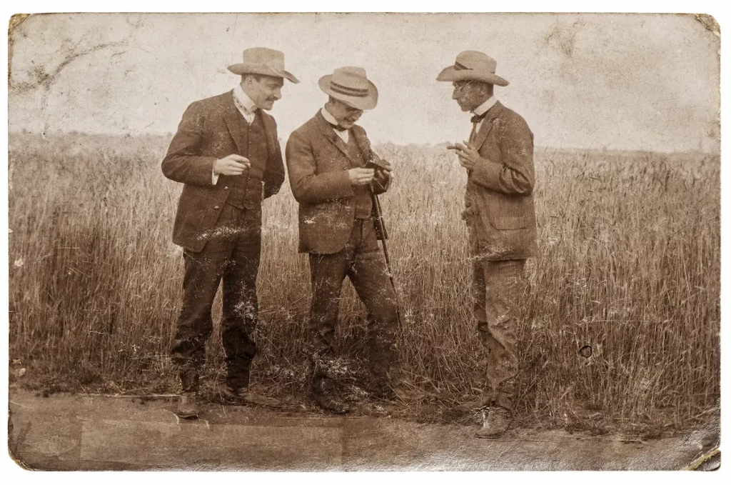 Vintage picture of our forefathers standing in a field socializing