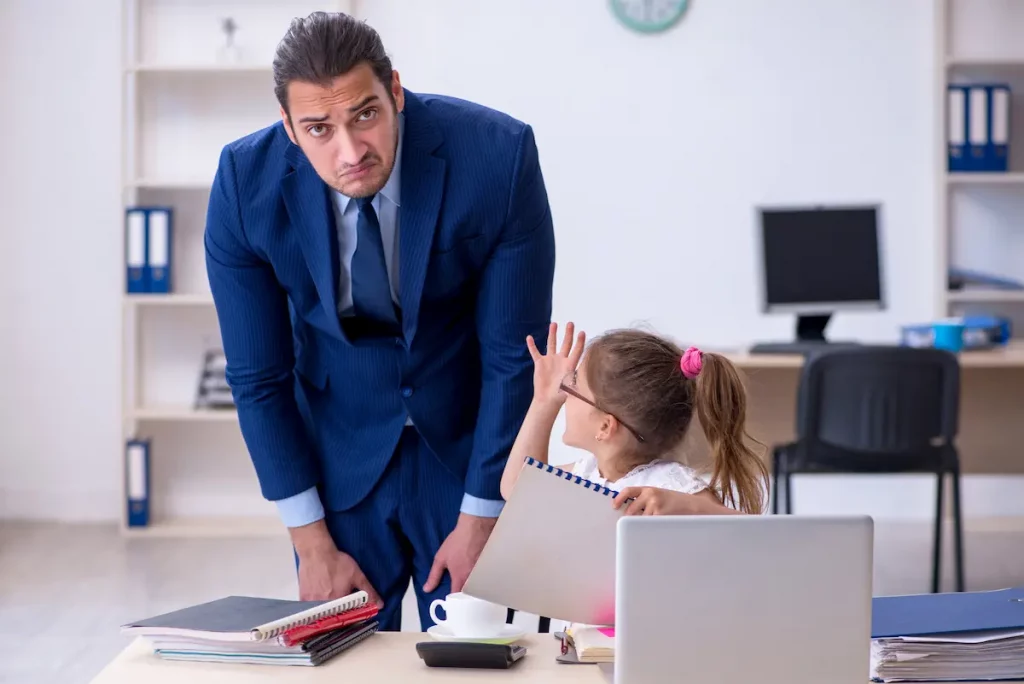 Annoying dad standing over shoulder of his daughter checking her work