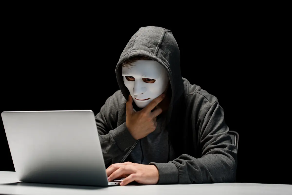young man using laptop incognito