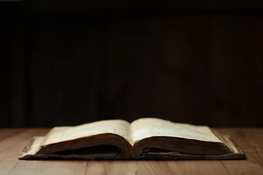 Holy scripture book laying open on wooden table