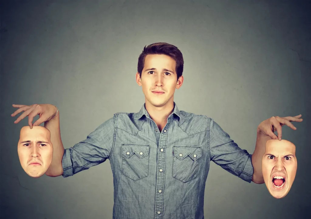 Man holding two different emotion masks symbolizing Borderline Personality Disorder