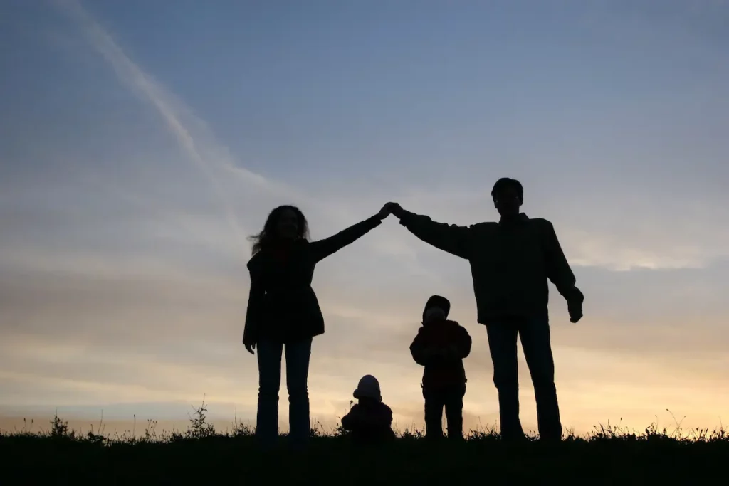 Silhouette of family showing team work and a positive parenting style