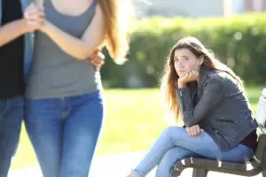 Girls sitting on bench has stomach drop watching ex walk by with new partner