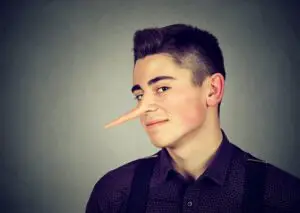 Man with long extended nose indicating he's a pathological liar