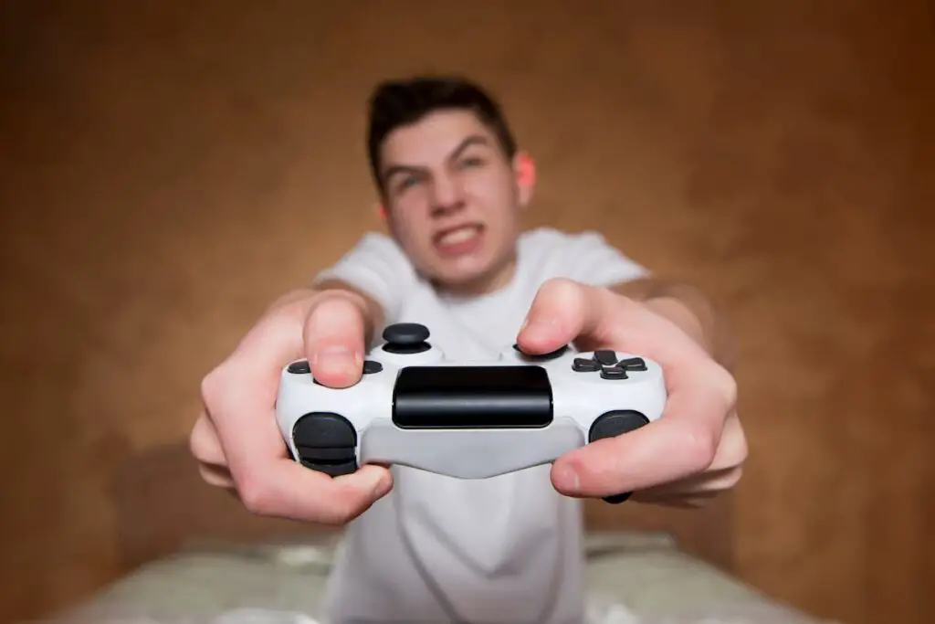young male addcited to video games close up